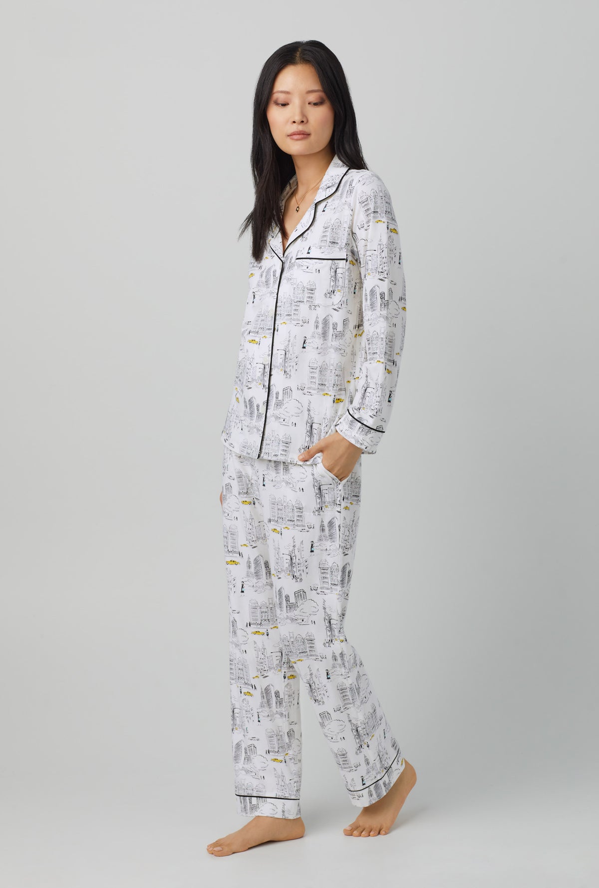 A lady wearing white Long Sleeve Classic Stretch Jersey PJ Set with City That Never Sleeps  print