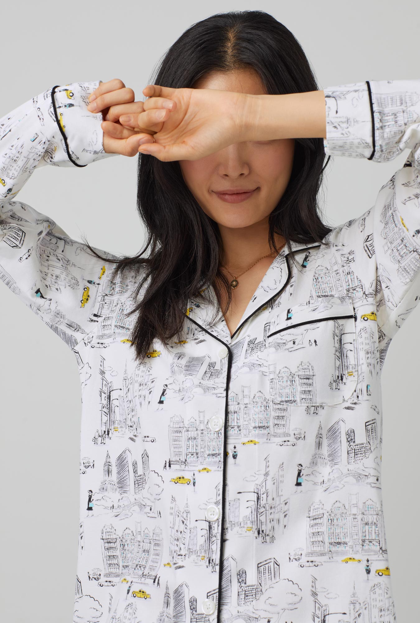 A lady wearing white Long Sleeve Classic Stretch Jersey PJ Set with City That Never Sleeps  print