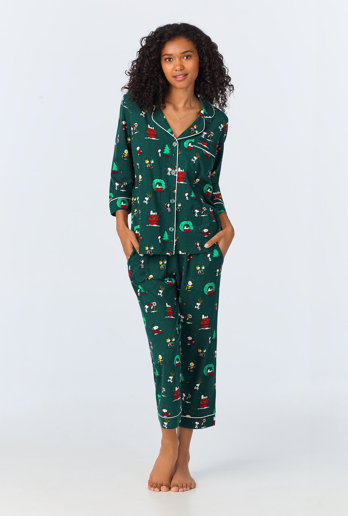 A lady wearing Peanuts® Winter Holiday 3/4 Sleeve Classic Stretch Jersey Cropped PJ Set