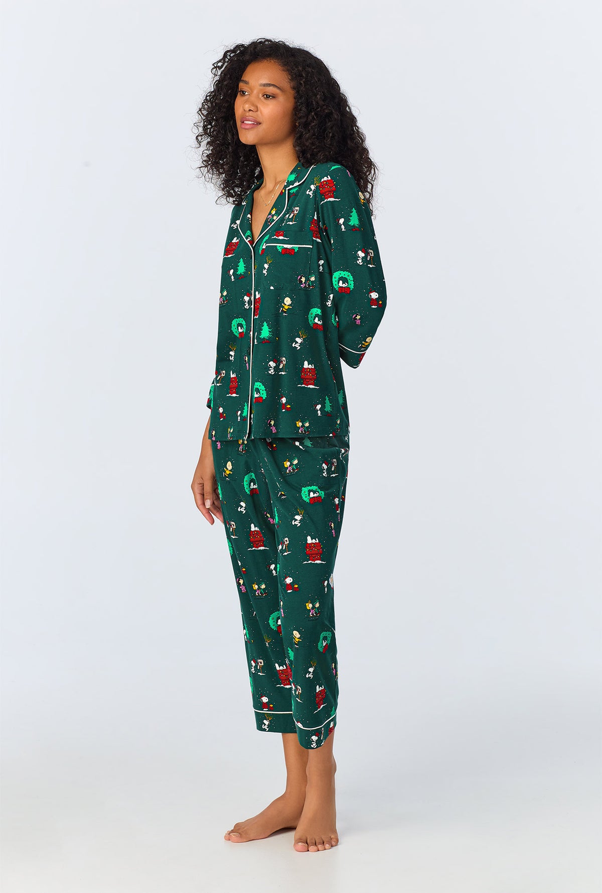 A lady wearing Peanuts® Winter Holiday 3/4 Sleeve Classic Stretch Jersey Cropped PJ Set