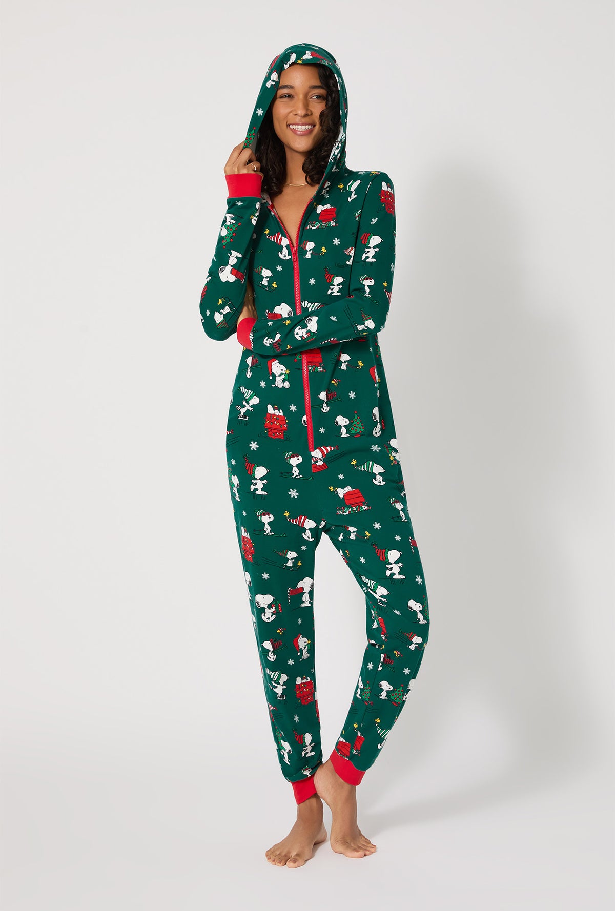 A lady wearing ®Snoopy's Holiday Fun Long Sleeve Stretch Jersey Unisex Onesie