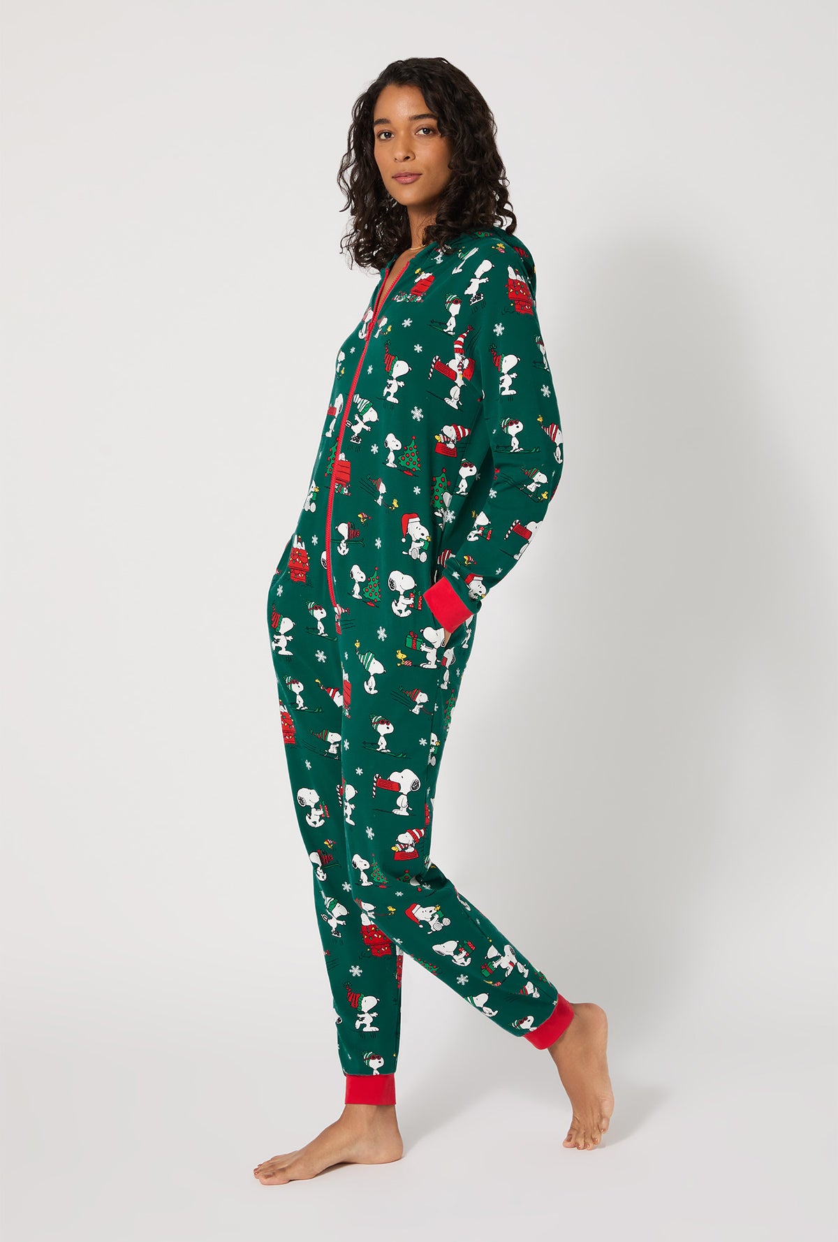 A lady wearing ®Snoopy's Holiday Fun Long Sleeve Stretch Jersey Unisex Onesie