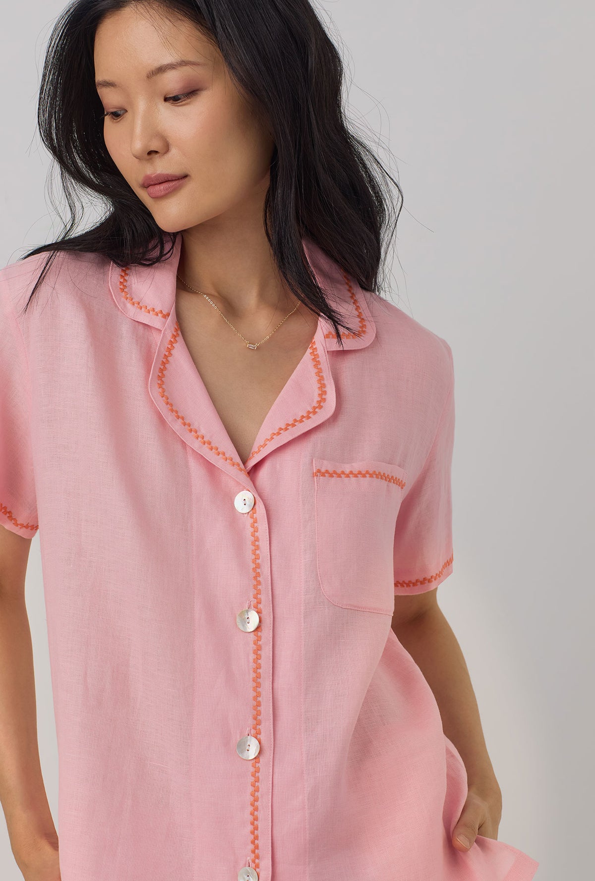 A lady wearing pink Short Sleeve Classic Shorty Woven Linen PJ Set with Orchid Pink print.