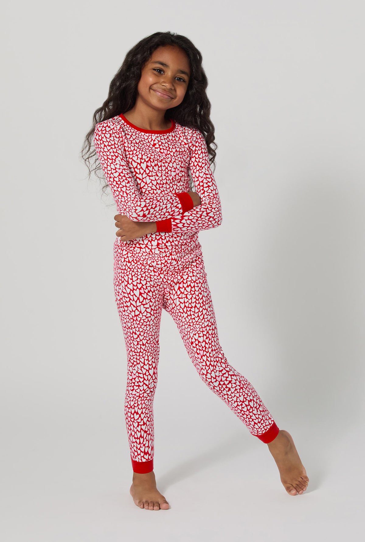 A girl wearing Bursting With Love Long Sleeve Stretch Jersey Kids Pj Set