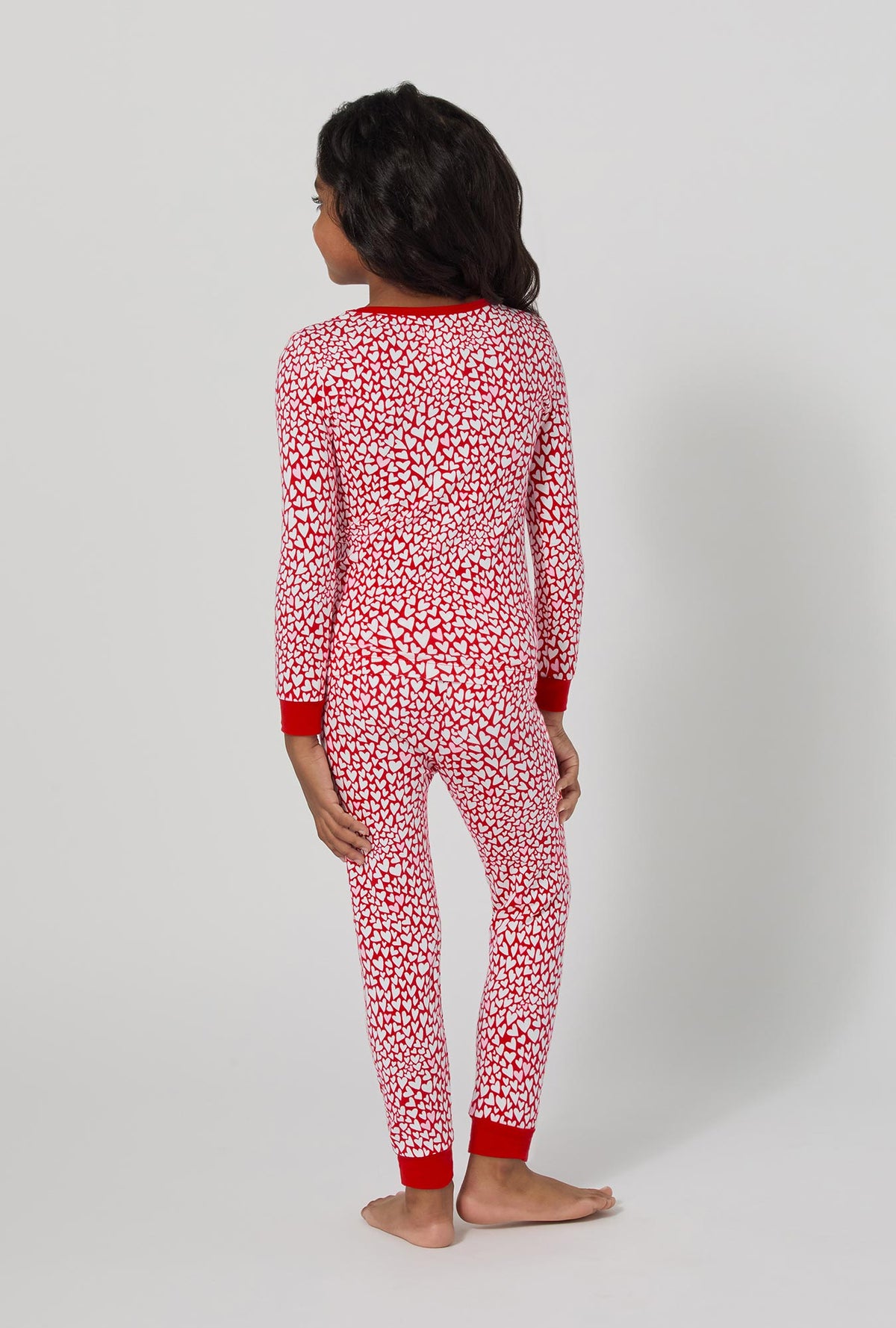 A girl wearing Bursting With Love Long Sleeve Stretch Jersey Kids Pj Set