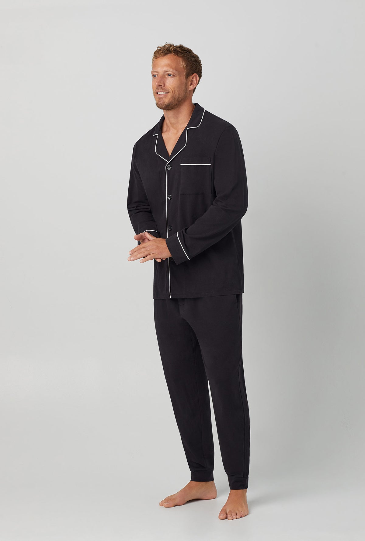 A men wearing  Long Sleeve and Jogger Stretch Jersey PJ Set with Black Beauty print