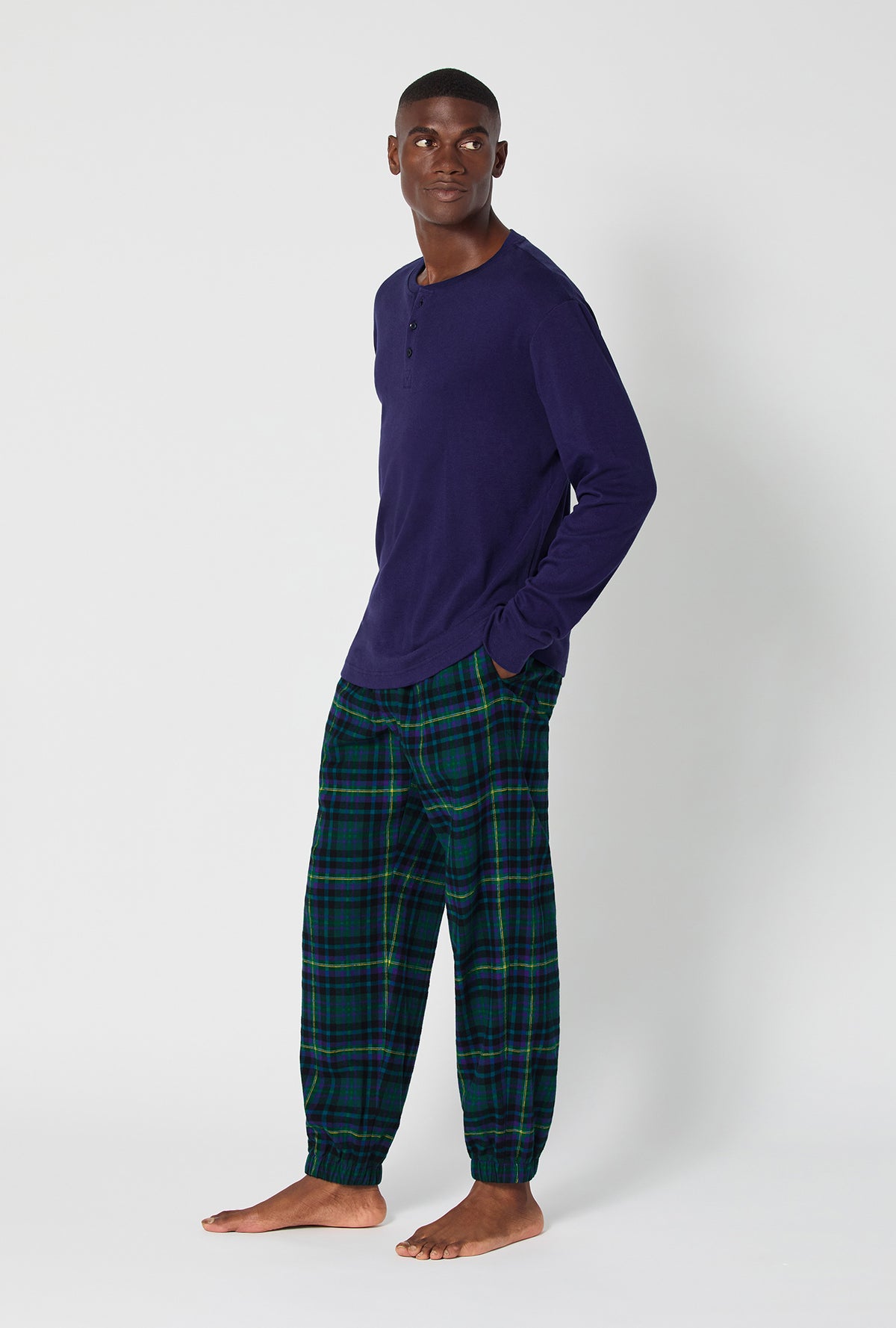 A man wearing Walden Plaid Long Sleeve Henley And Jogger Woven Portuguese Flannel PJ Set