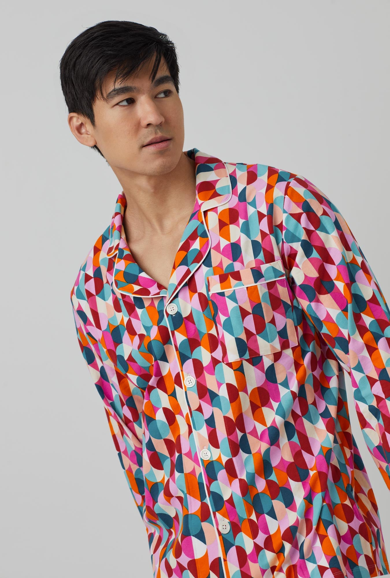 A man wearing Long Sleeve Classic Stretch Jersey PJ Set with dancing dots print