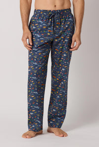 A man wearing Brian's Aquarium Men's Woven Tana Lawn® Pj Pant Made With Liberty Fabrics