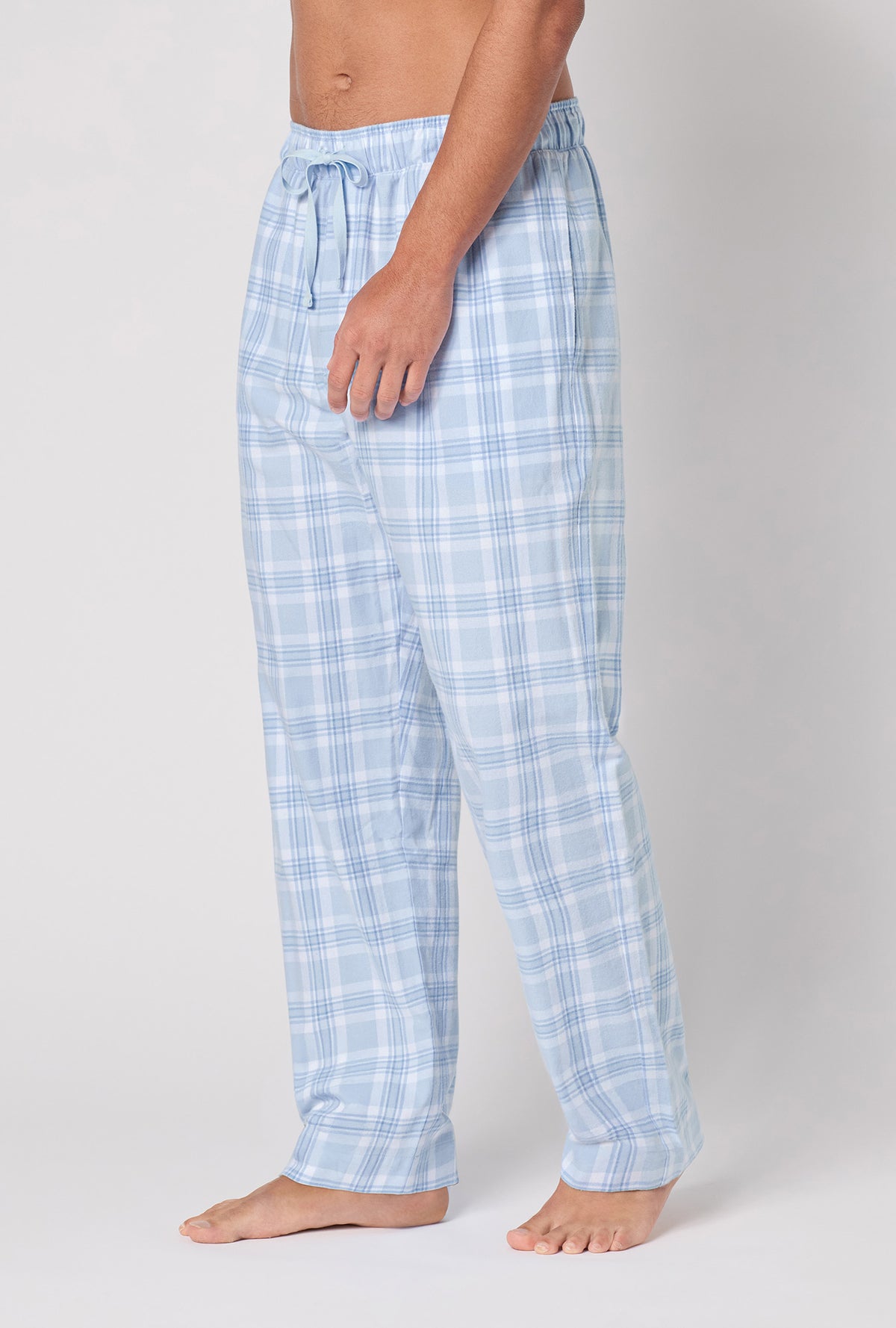 A man wearing Meadow Haze Plaid Men's Woven Portuguese Flannel Pj Pant side view