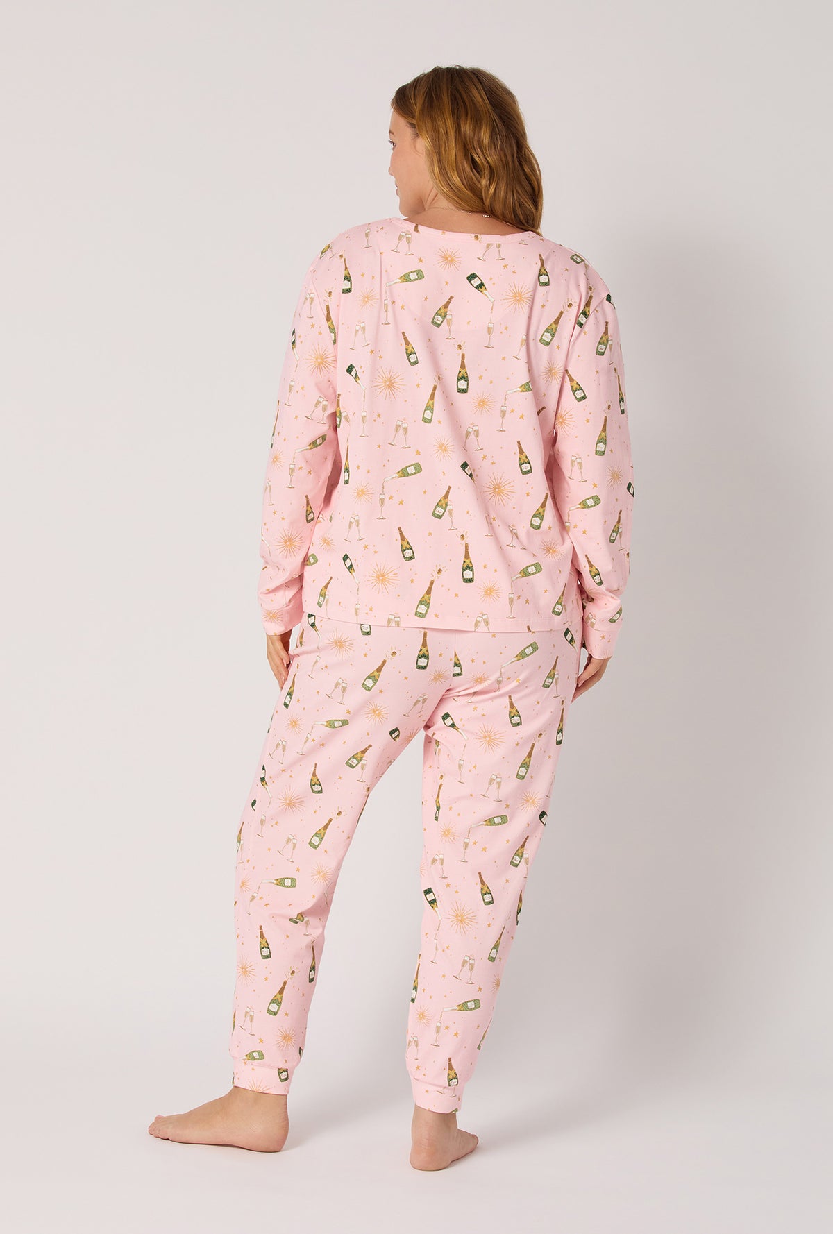 A Lady wearing Pop Fizz Clink Long Sleeve Pullover Crew And Jogger Stretch Jersey Pj Set