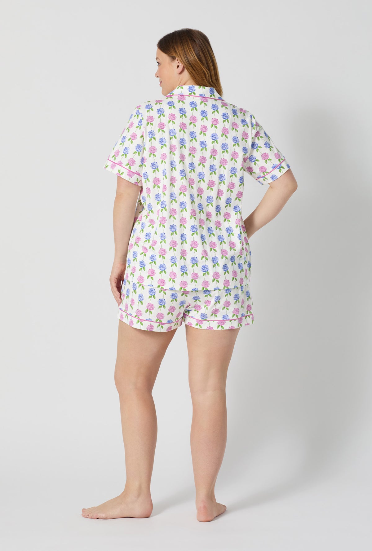 A lady wearing plus size Cottage Parlor Short Sleeve Classic Shorty Stretch Jersey Pj Set back view