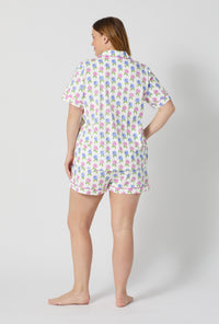 A lady wearing plus size Cottage Parlor Short Sleeve Classic Shorty Stretch Jersey Pj Set back view