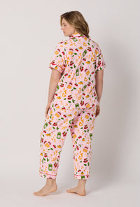 A lady wearing plus size Pink Short Sleeve Classic Stretch Jersey Cropped Pj Set back view