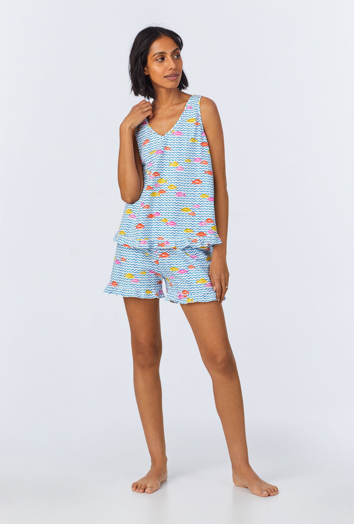 A lady wearing Marina Grande Ruffle Tank Stretch Jersey Shorty PJ Set