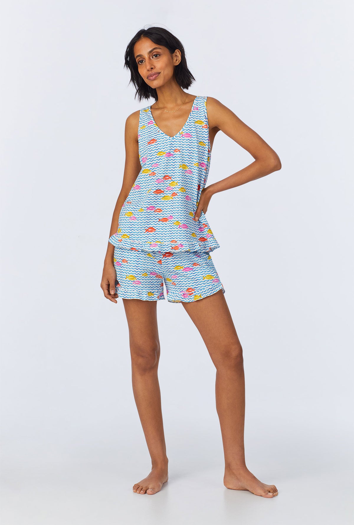 A lady wearing Marina Grande Ruffle Tank Stretch Jersey Shorty PJ Set