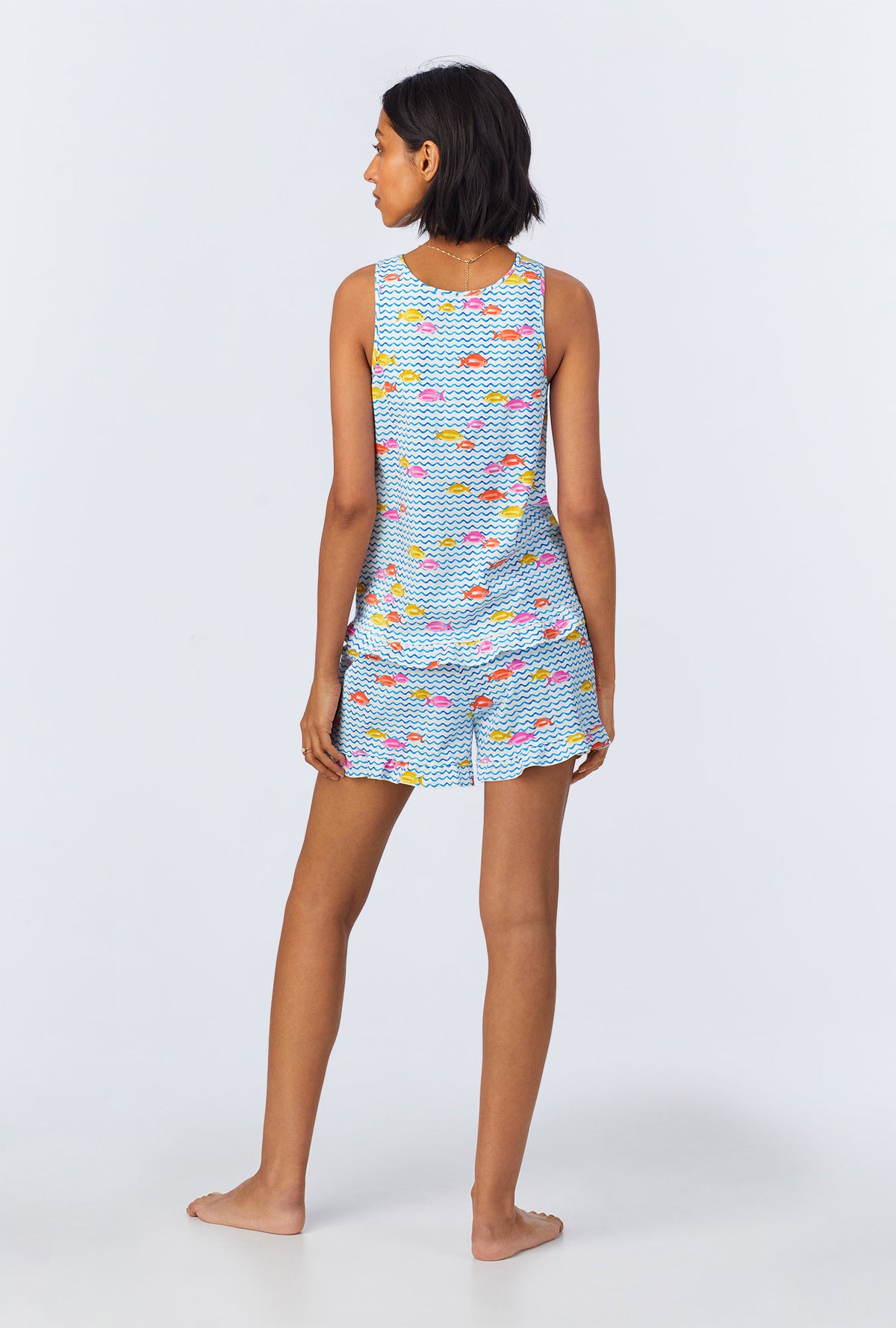 A lady wearing Marina Grande Ruffle Tank Stretch Jersey Shorty PJ Set