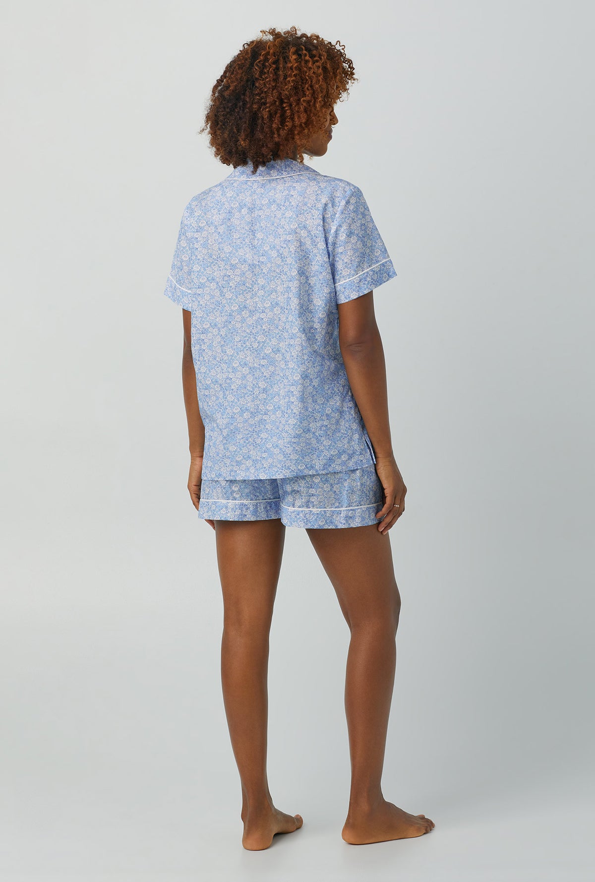 A lady wearing Short Sleeve Classic Woven Cotton Silk PJ Set with something blue print