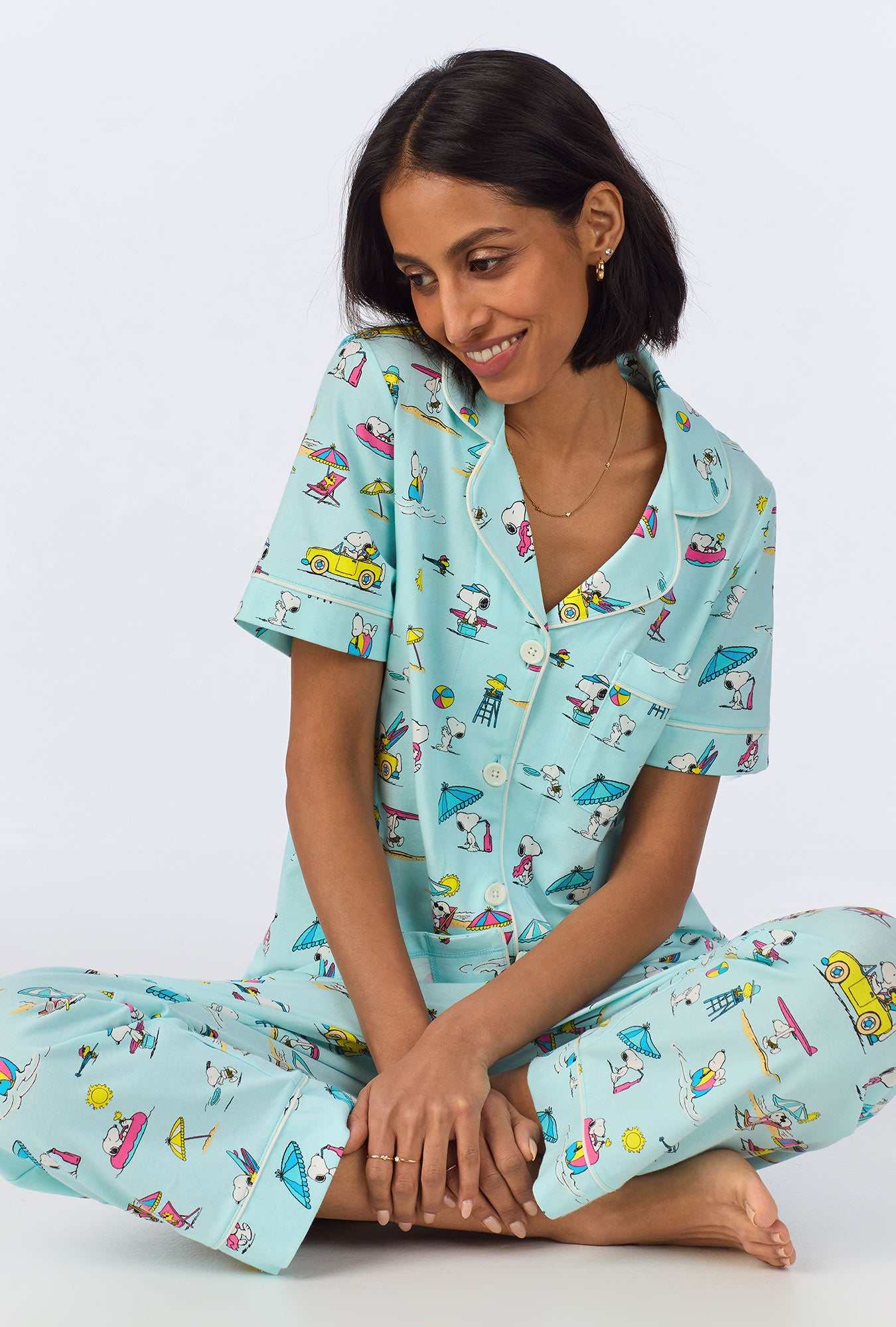 A lady wearing Surfside Snoopy® Short Sleeve Classic Cropped Stretch Jersey PJ Set