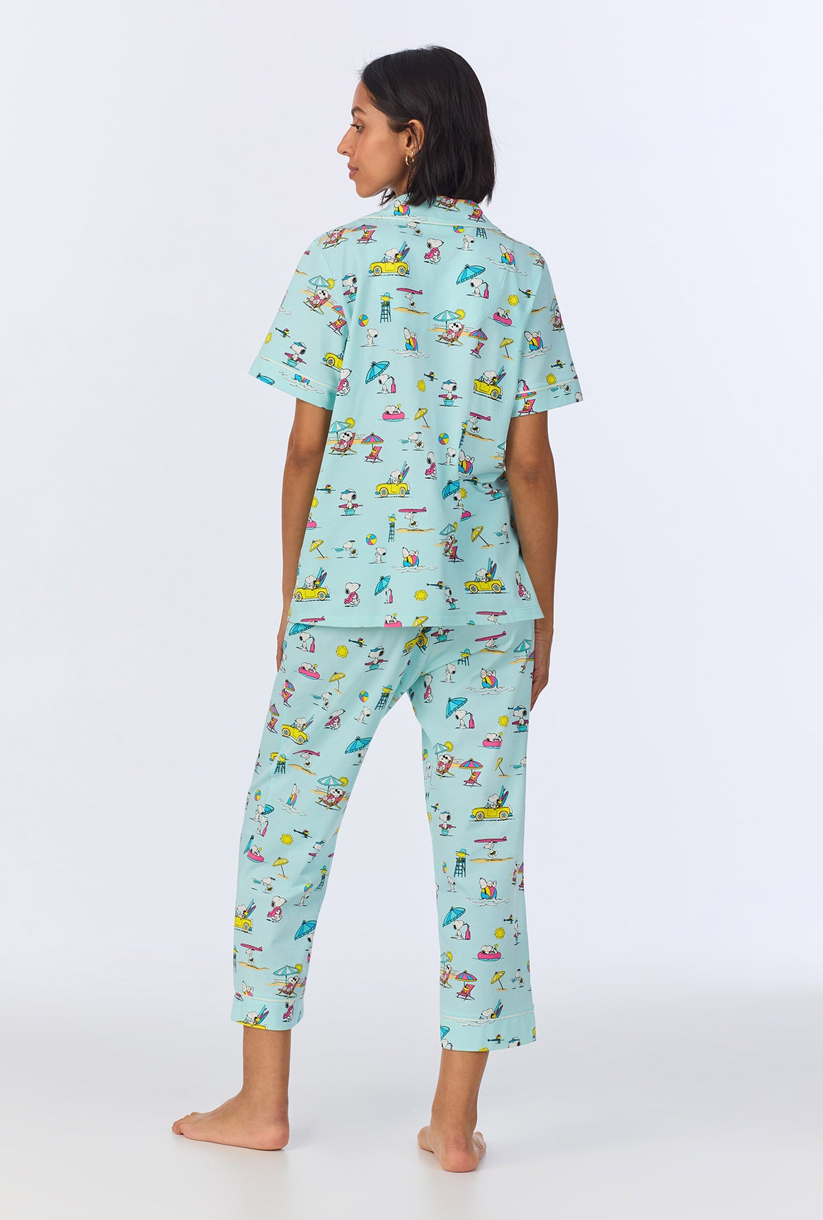 A lady wearing Surfside Snoopy® Short Sleeve Classic Cropped Stretch Jersey PJ Set