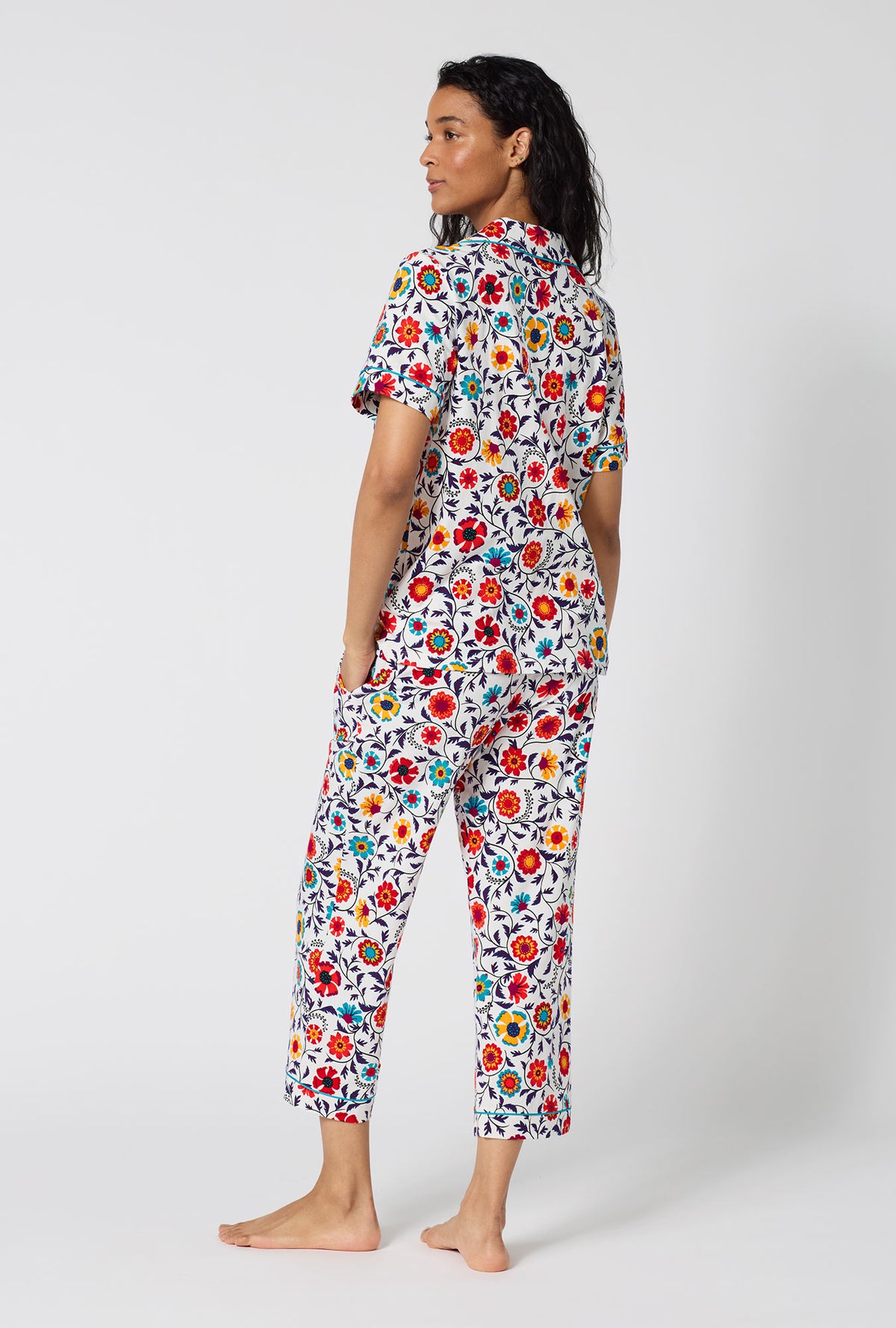 A Lady Wearing Ottoman Bloom Short Sleeve Classic Stretch Jersey Cropped Pj Set in a back view pose
