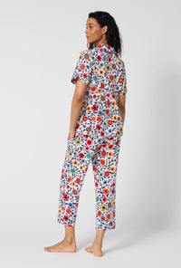 A Lady Wearing Ottoman Bloom Short Sleeve Classic Stretch Jersey Cropped Pj Set in a back view pose