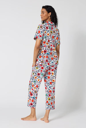 A Lady Wearing Ottoman Bloom Short Sleeve Classic Stretch Jersey Cropped Pj Set in a back view pose