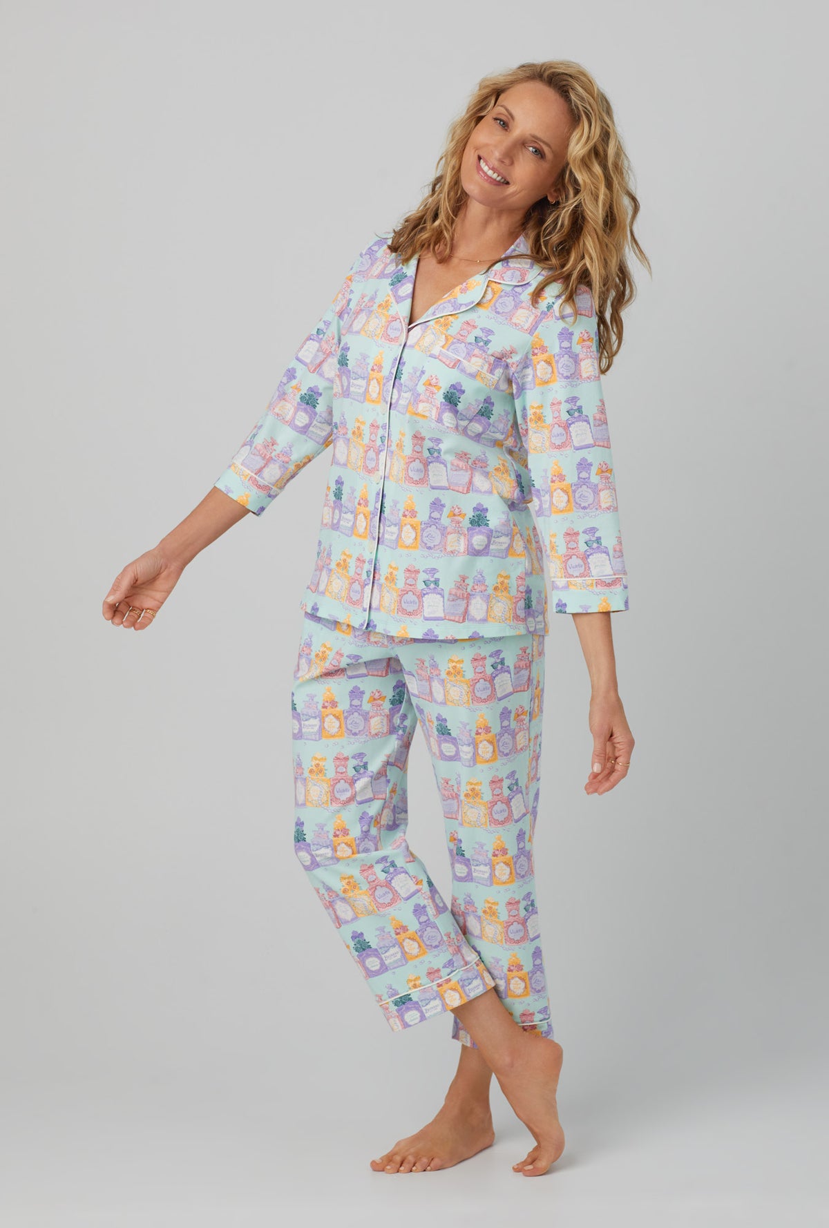 A lady wearing 3/4 sleeve classic stretch jersey cropped pj set with perfect scents print