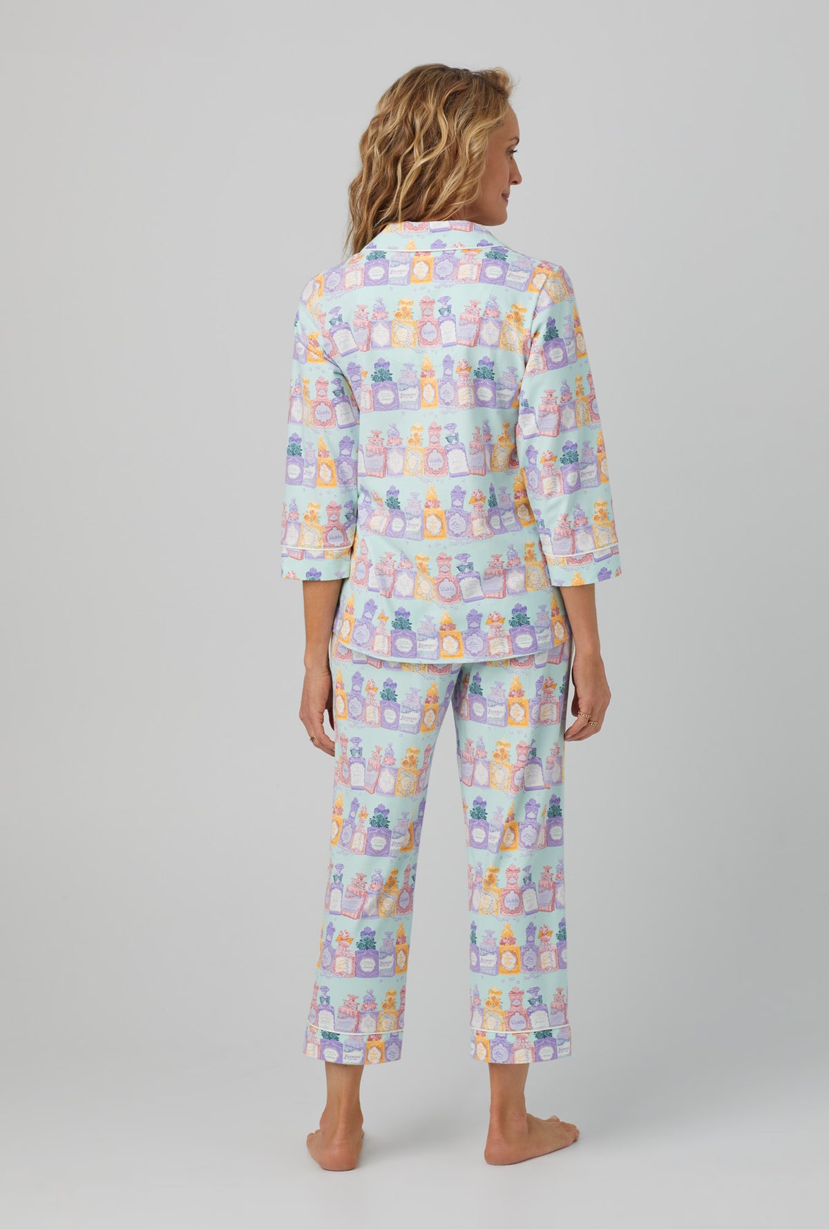 A lady wearing 3/4 sleeve classic stretch jersey cropped pj set with perfect scents print