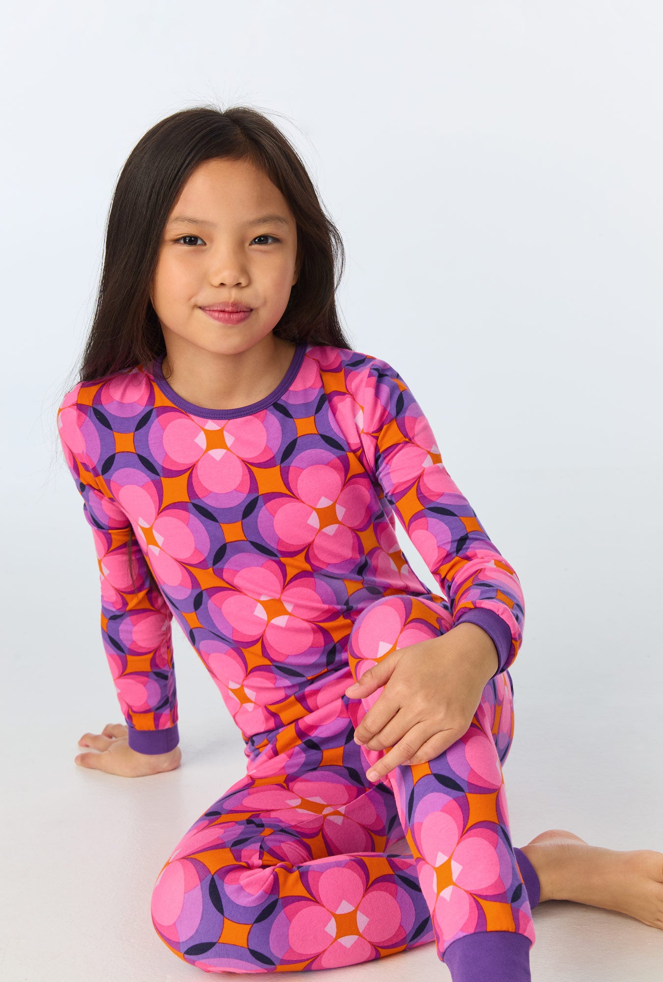 A girl wearing  Space Cat Long Sleeve Stretch Jersey Kids PJ Set