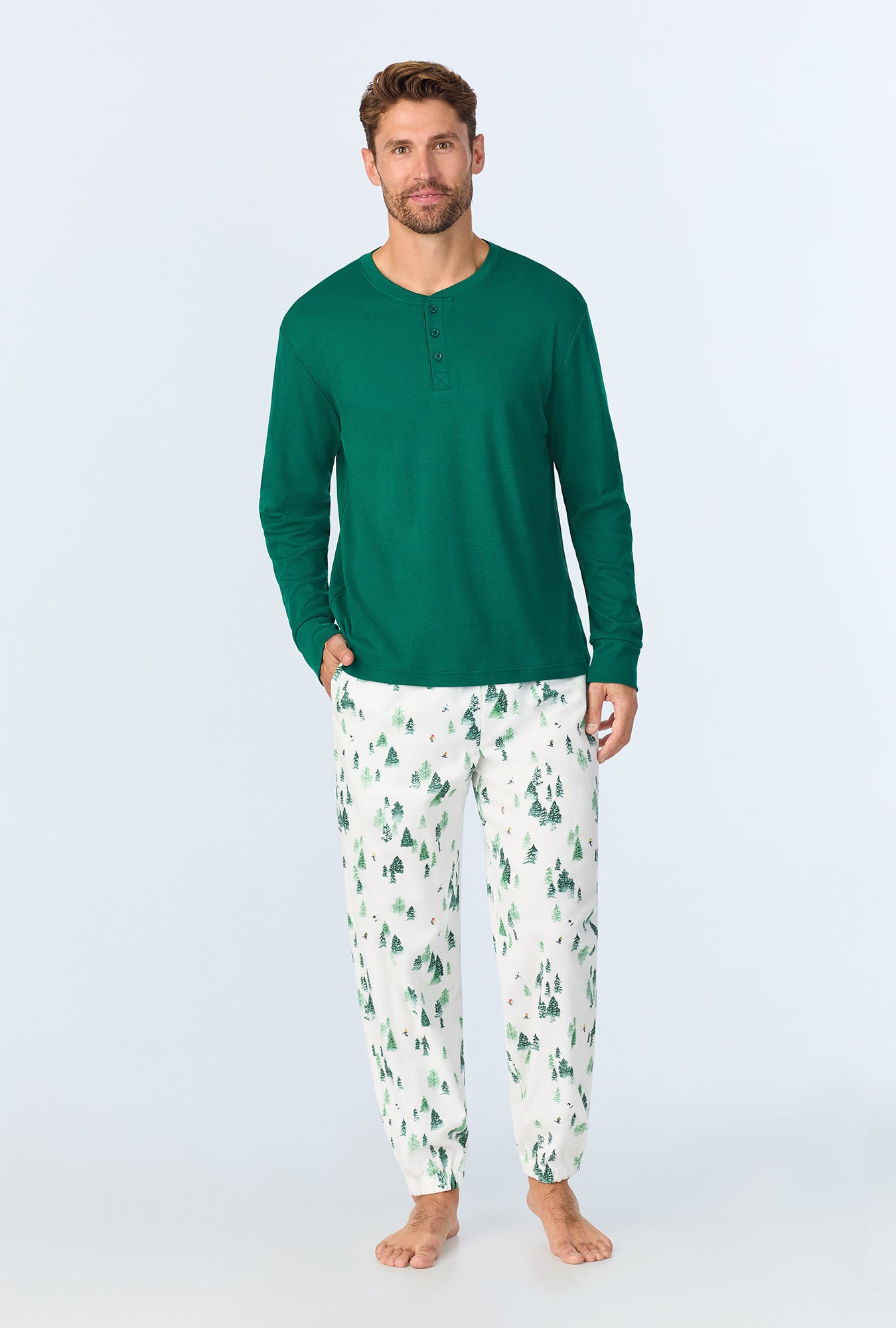 A man wearing Hit the Slopes Men's Long Sleeve Henley and Jogger Woven Portuguese Flannel PJ Set