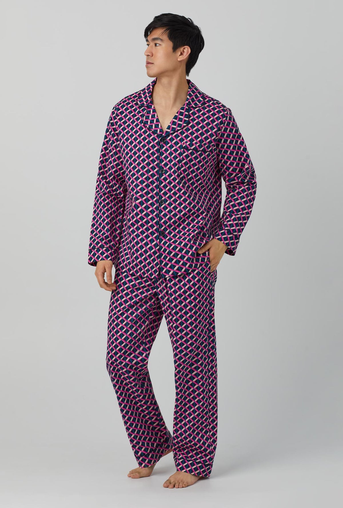A man wearing long sleeve classic woven cotton poplin pj set with Mr. turk lattice geo print.