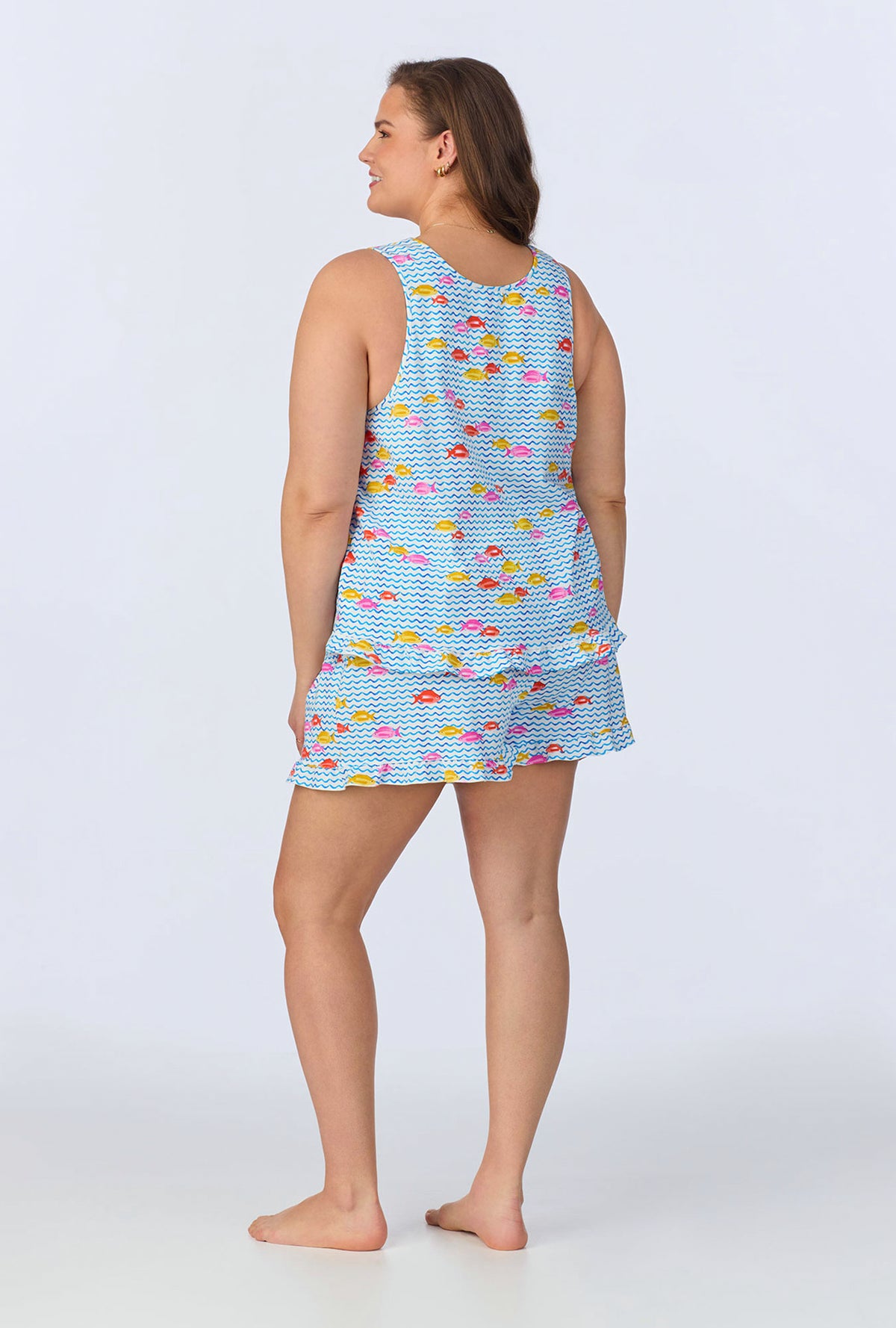 A lady wearing Marina Grande Ruffle Tank Stretch Jersey Shorty PJ Set