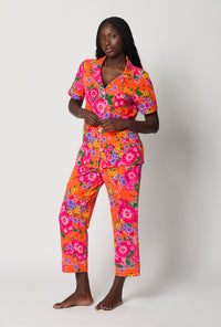 A lady wearing Orange Short Sleeve Classic Stretch Jersey Cropped Pj Set side view