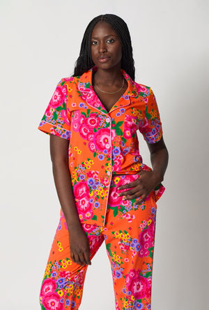 A closeup of A lady wearing Orange Short Sleeve Classic Stretch Jersey Cropped Pj Set