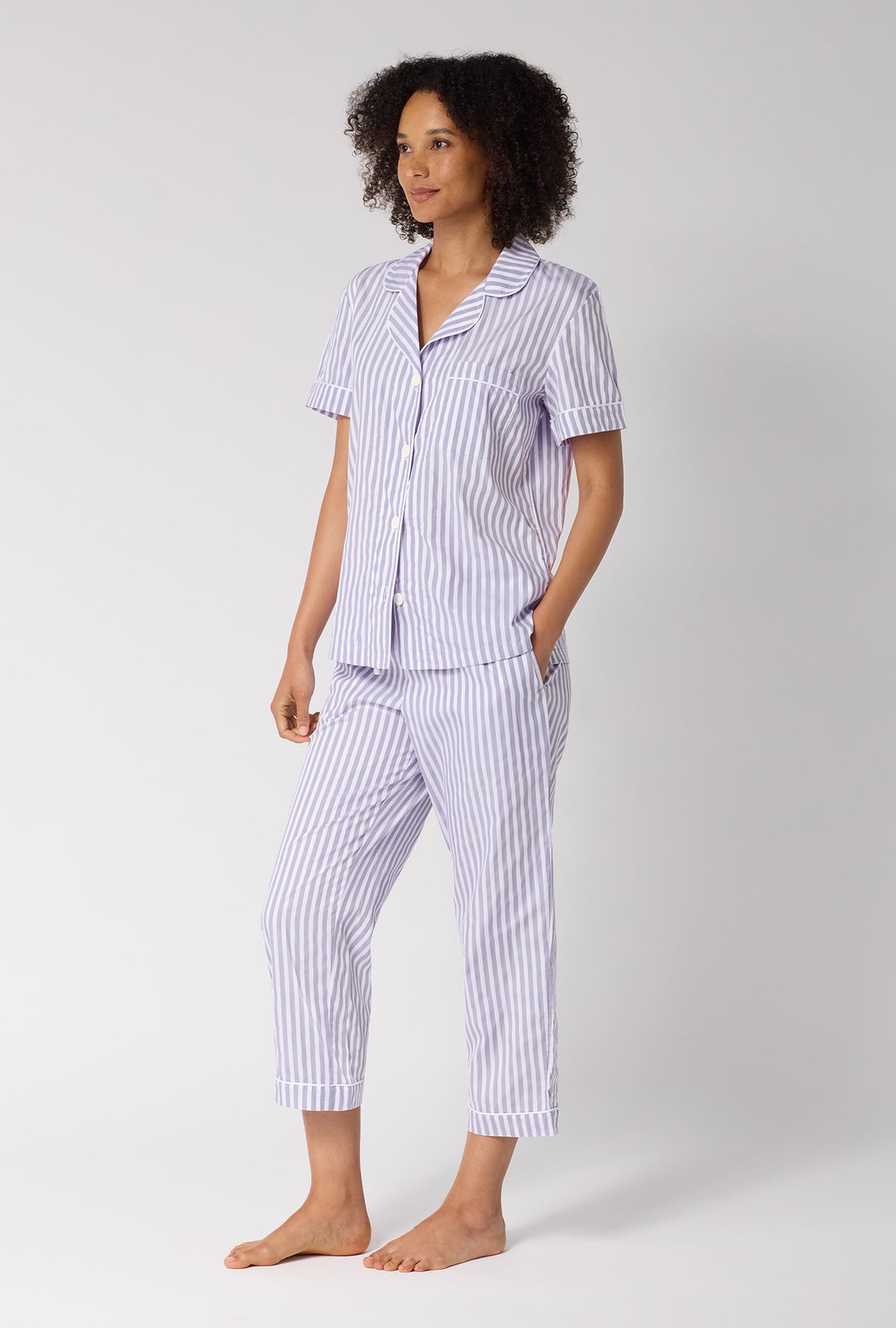 A Lady Wearing Blue Signature Stripe Short Sleeve Classic Woven Cotton Sateen Cropped Pj Set in a side angled pose