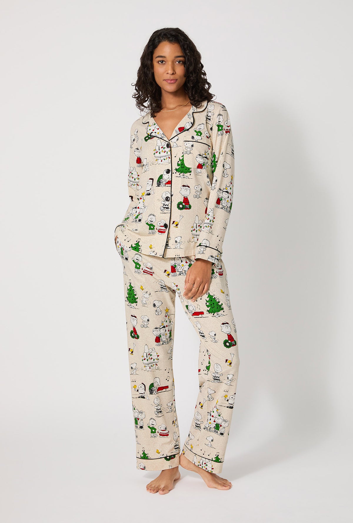 A lady wearing Peanuts® Celebration Long Sleeve Classic Stretch Jersey Pj Set