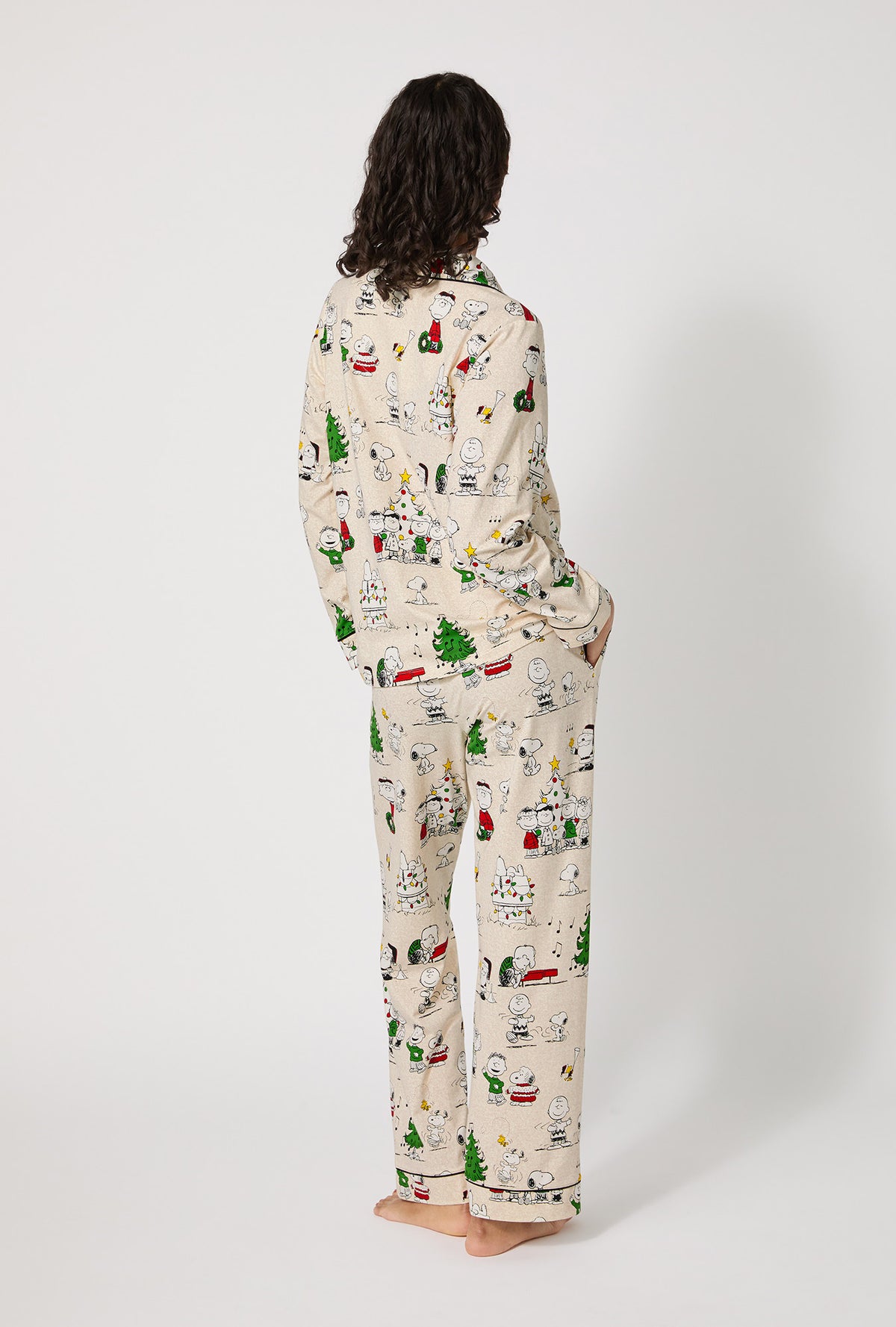 A lady wearing Peanuts® Celebration Long Sleeve Classic Stretch Jersey Pj Set