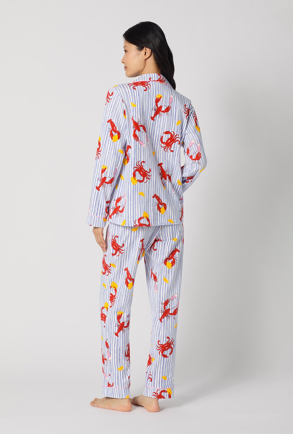 A lady wearing Coastal Feast Long Sleeve Classic Stretch Jersey Pj Set back view