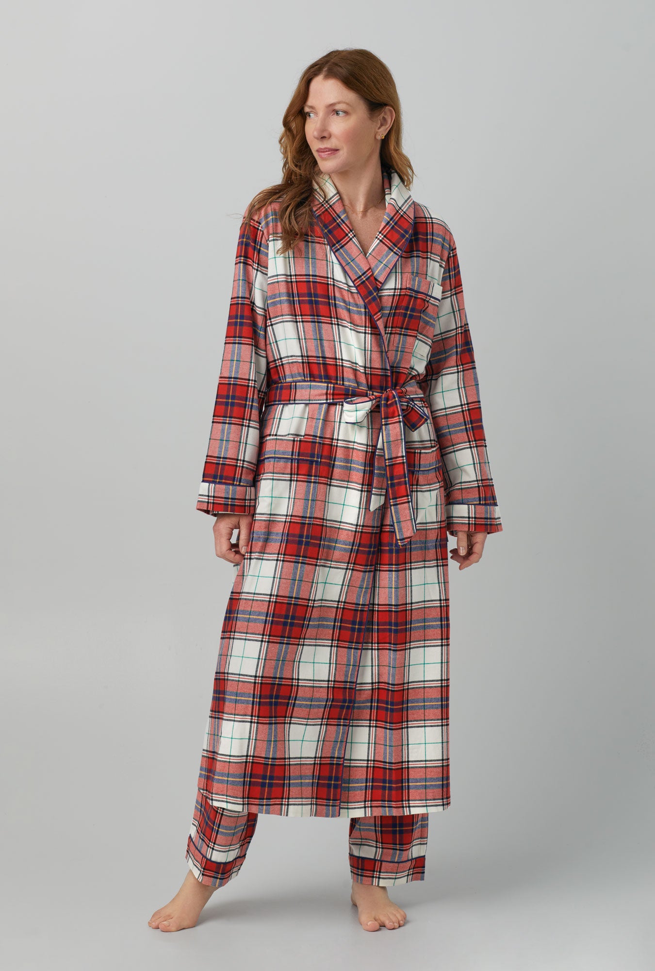 A lady wearing Unisex Classic Woven Cotton Portuguese Flannel Robe de Chambre with Festive Tartan print