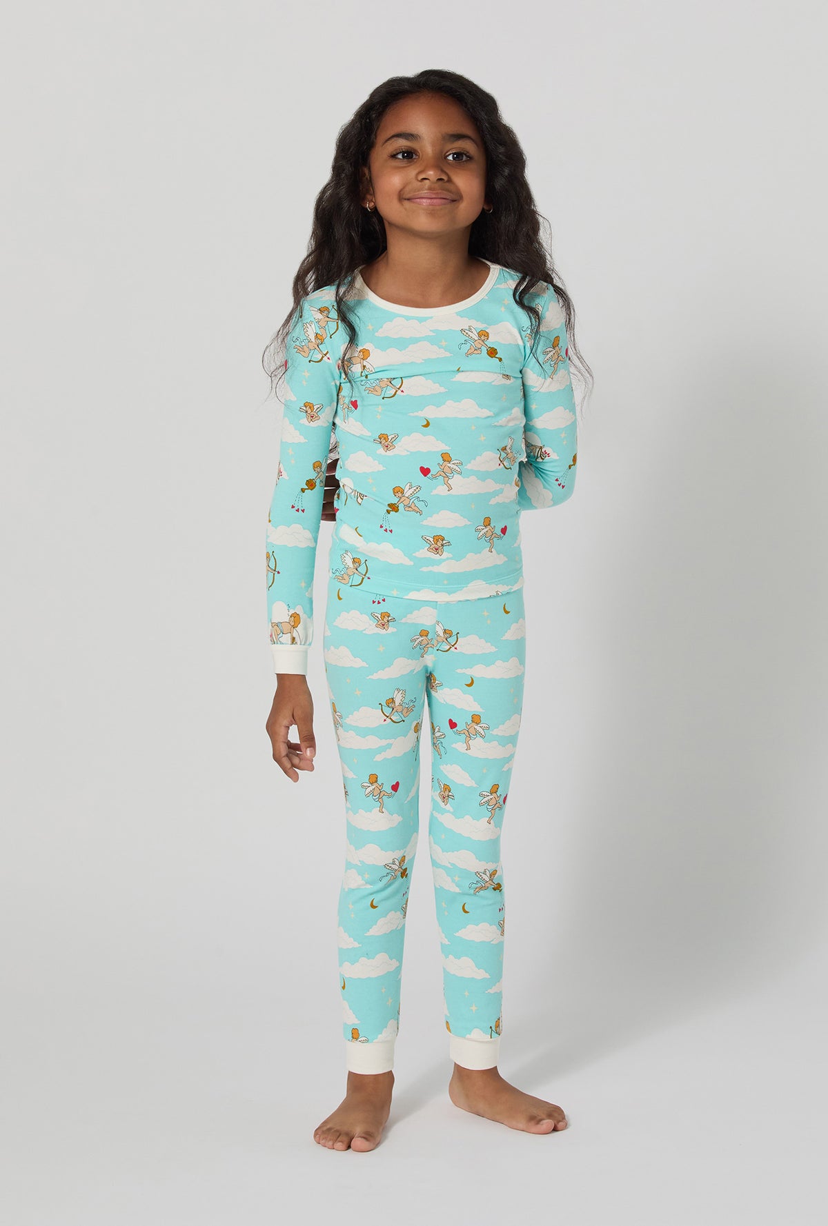 A girl wearing Cheeky Cupid Long Sleeve Stretch Jersey Kids Pj Set