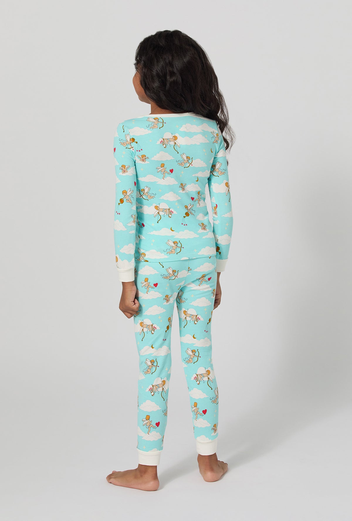 A girl wearing Cheeky Cupid Long Sleeve Stretch Jersey Kids Pj Set