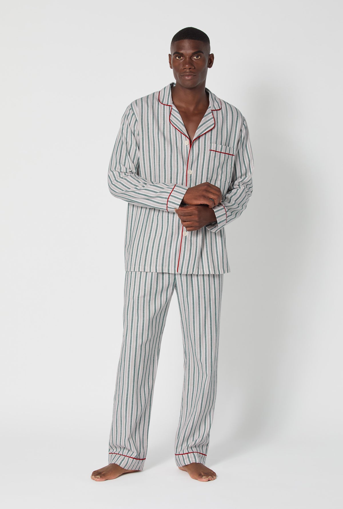 A man wearing Peppermint Stripe Men&#39;s Long Sleeve Classic Woven Portuguese Flannel PJ Set