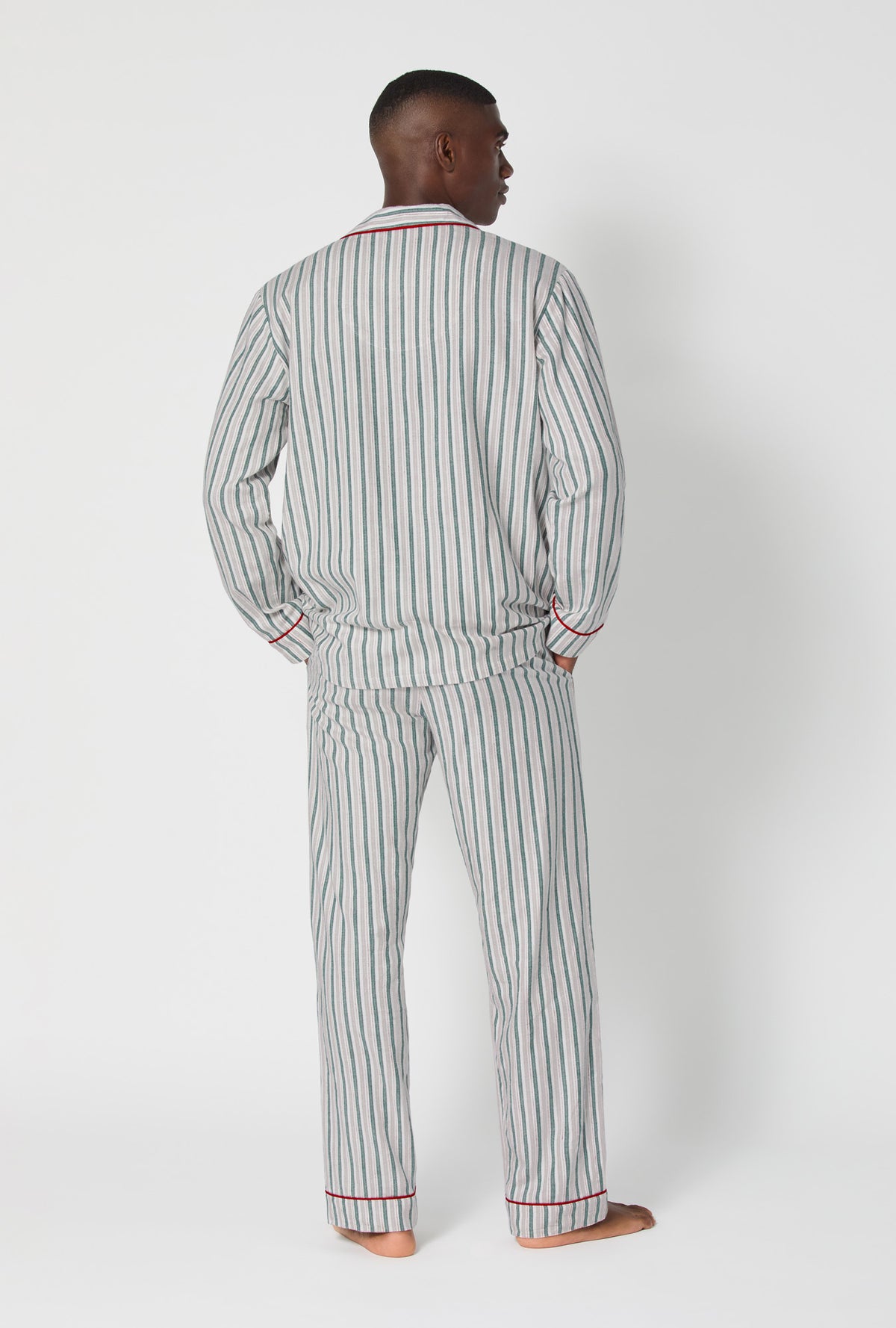 A man wearing Peppermint Stripe Men&#39;s Long Sleeve Classic Woven Portuguese Flannel PJ Set