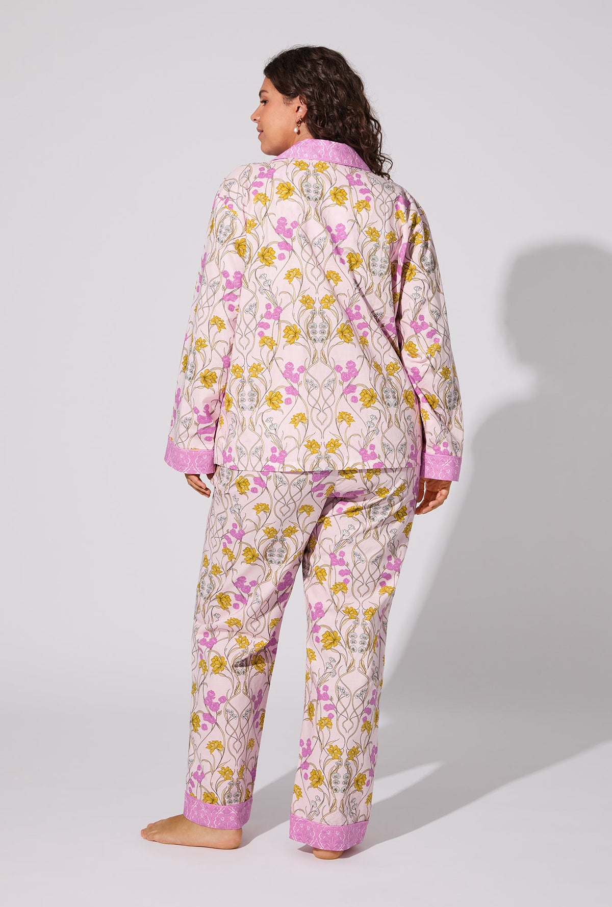 A lady wearing Fleur Nouveau Long Sleeve Classic Woven Cotton Poplin PJ set