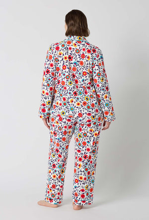 A Lady Wearing Plus Size Ottoman Bloom Long Sleeve Classic Stretch Jersey Pj Set in a back view pose