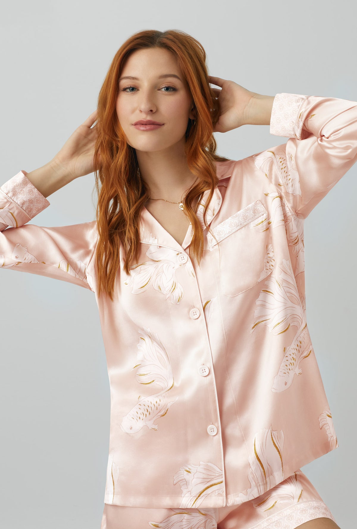A lady wearing Long Sleeve Classic Washable Silk Satin Short PJ Set with koi pond print