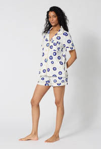 A Lady Wearing Eyeconic Short Sleeve Classic Shorty Stretch Jersey Pj Set in a front side angled pose