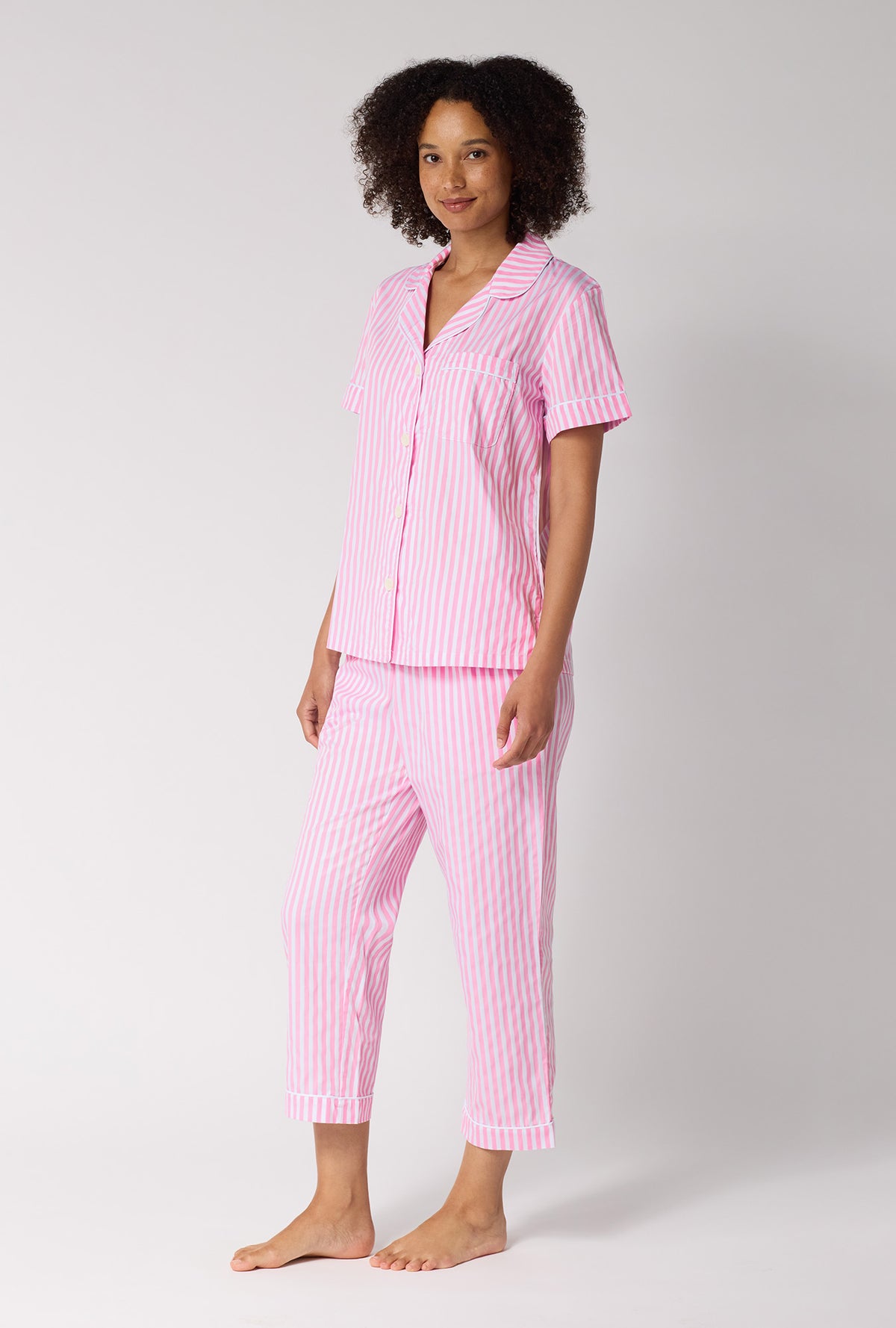 A Lady Wearing Pink Signature Stripe Short Sleeve Classic Woven Cotton Sateen Cropped Pj Set in a side angled pose
