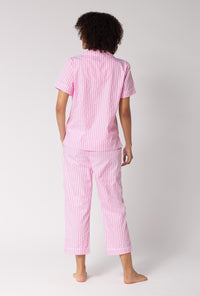 A Lady Wearing Pink Signature Stripe Short Sleeve Classic Woven Cotton Sateen Cropped Pj Set in a standing back view pose
